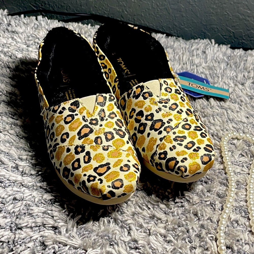 Toms brand. Brand new with tags size 7. Leopard print shoes